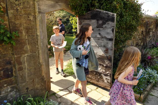 Children on the Cadbury Easter Egg Hunt trail in the Forecourt Garden at Nymans, West Sussex