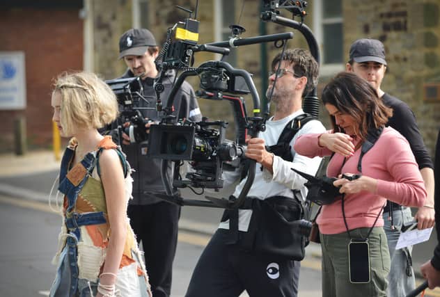 Filming of a trailer for The Tempest in Rock-a-Nore Road, Hastings. Featuring Raffiella Chapman. SUS-220329-080318001