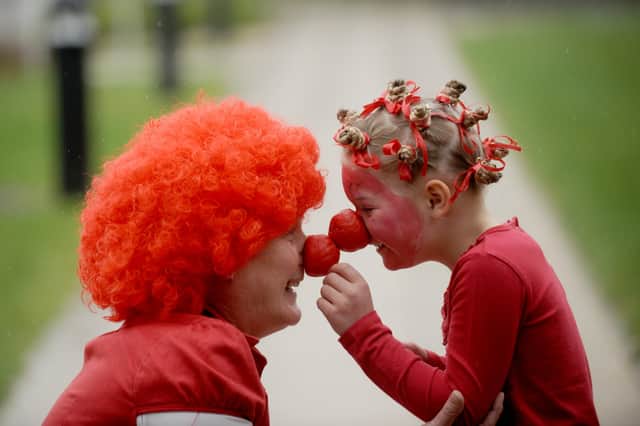 Head teacher Gill Standing nose to nose with Petworth Primary School pupil Aleashea Fry, six. Picture: Louise Adams
