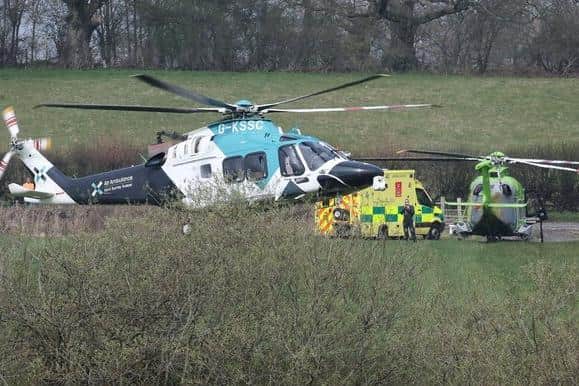 Emergency crews and air ambulance at the Cowfold crash scene.
