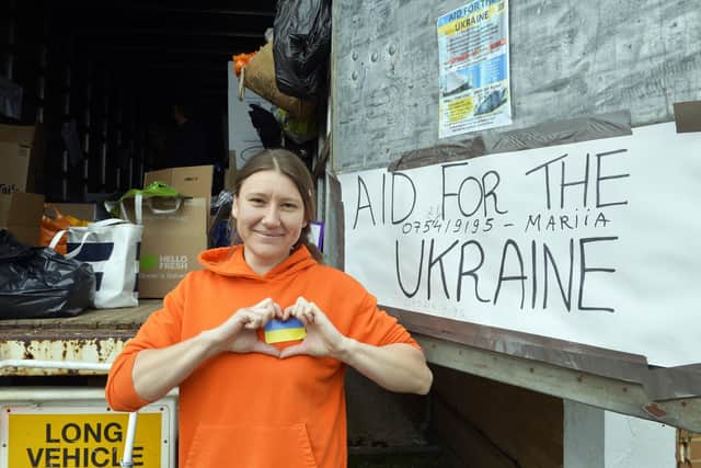 Mariia Savvinova is collecting donations for Ukraine and loading them on to a lorry at JWD Removals (Photo by Jon Rigby) SUS-220330-132405008
