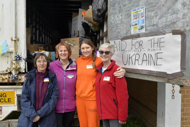 Mariia Savvinova (second from right) is collecting donations for Ukraine and loading them on to a lorry at JWD Removals, being helped by Mary Morley, Maria Huk and Tina Hall (Photo by Jon Rigby) SUS-220330-132441008