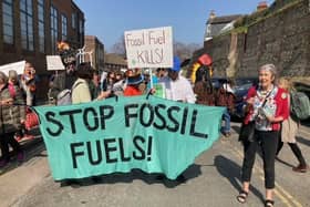 Members of two major environmentalist groups walked through Lewes to protest against the UK's continued dependence on fossil fuels.