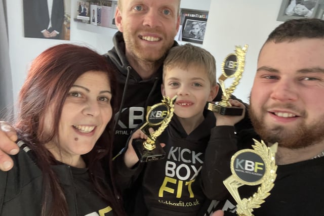 Peter Murphy, joint owner of Kickboxfit martial arts academy, with his wife and children, Max, seven, and James, 18