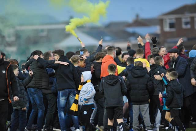 Fans celebrate Golds reaching the last round / Picture: Stephen Goodger