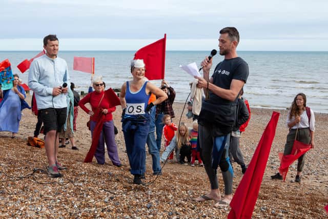 Clean Water Action during a recent protest. Becca Horn, pictured here in the blue, has spoken out against Southern Water after they released sewage into bathing water in Bexhill and St Leonards. SUS-220331-131003001