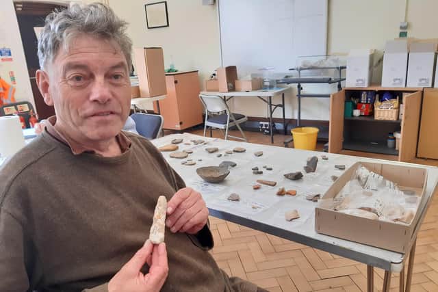 Alex Vincent with a Neolithic stone tool he found on Broadwater Green