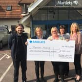 The Martlets telephone hub team in the photo Tracy Keeley, Amanda Bell, Carron Maskell and Tina Phillips with Richard Pink from Barclays