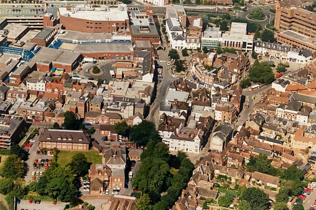 Horsham in the late 1990s, showing the Causeway, Carfax, and shopping centre from the sky