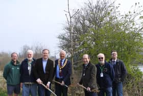 Councillor Christian Mitchell, Councillor David Skipp and Councillor Roger Noel with Friends of Warnham Local Nature Reserve and Horsham Council's Parks and Countryside team plant a chestnut tree to mark the bicentenary of Shelley's death.