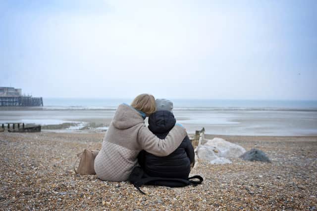 Oksana and her ten-year-old son, pictured on the beach at Worthing, were among the first to leave Ukraine after the Russian invasion began. Photo: Steve Robards