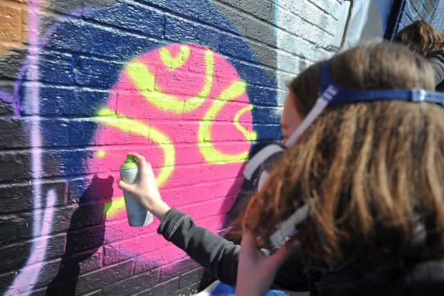 Mural spraying at Club 39 Bognor youth club. Pic S Robards SR2204042 SUS-220404-132018001
