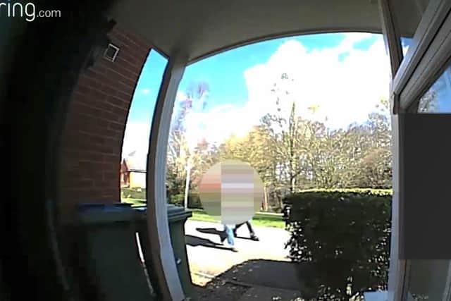 A still of the doorbell video footage at the centre of a row over a Conservative leaflet being taken out of a letterbox by a Green Party volunteer