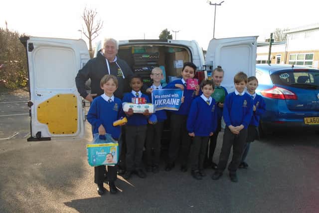 Pupils from OLQOH, together with Paul Mansfield, one of the OLQOH’s Premises Team