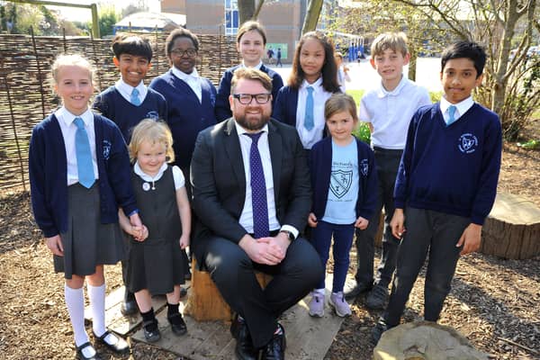 St Richards Catholic school, Chichester celebrate their Ofsted report.Headmaster James Field with pupils. Pic S Robards SR2203243 SUS-220324-162342001