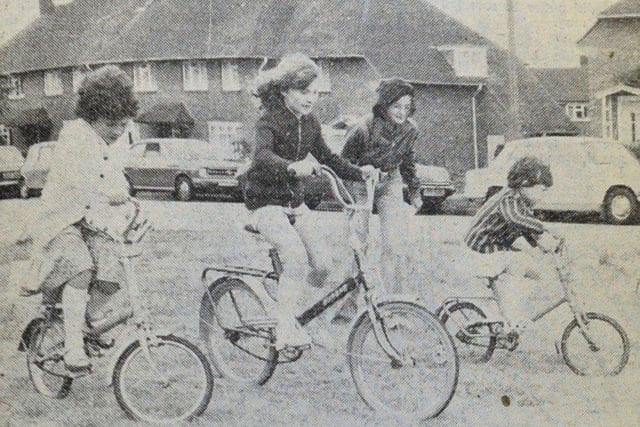 Children in Belloc Road, Littlehampton, competing in a slow bicycle race a their jubilee street party