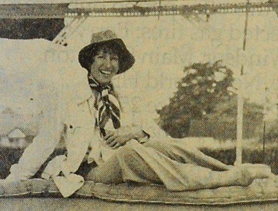 Hilary Green risks a tumble for a good cause with the Tip the Lady Out of Bed game at the Buckingham Park Jubilee Spectacular on Monday, June 6, 1977