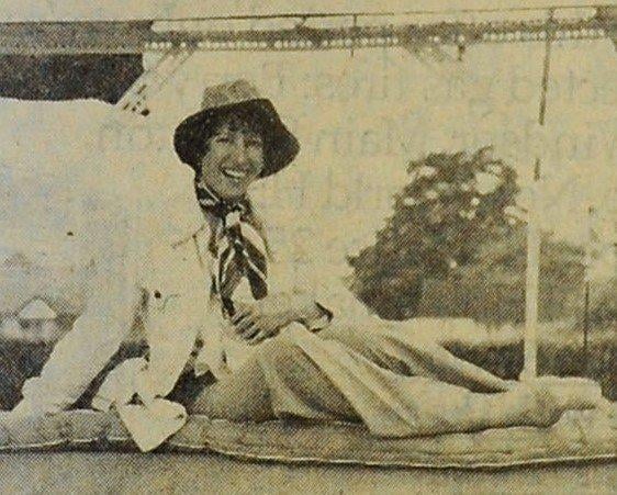 Hilary Green risks a tumble for a good cause with the Tip the Lady Out of Bed game at the Buckingham Park Jubilee Spectacular on Monday, June 6, 1977