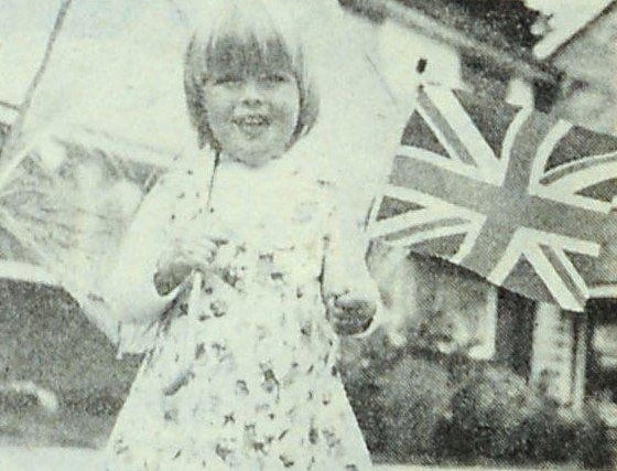 Two-year-old Amanda Sheppard making sure the rain did not spoil her fun at the jubilee street party in Overmead, Shoreham, on Tuesday, June 7, 1977