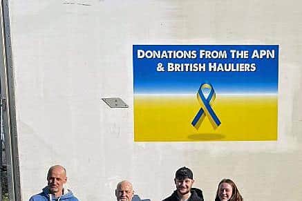 L-R Colin Palmer, Richard Topping, Ethan Topping and Anastasia Spencer from Pallet-Track member E&R Freight, who delivered vital aid to the Poland-Ukraine border on behalf of all UK pallet networks.