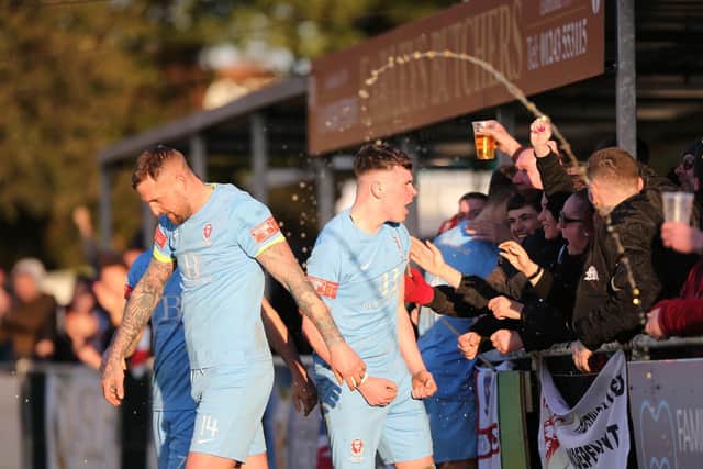 Players and fans celebrate during a United victory at Chichester City / Picture: Scott White