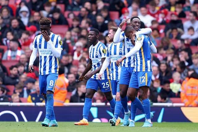 Brighton players celebrate their second goal against Arsenal at the Emirates Stadium during their 2-1 victory