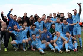 Champions! The triumphant Hastings United players celebrate the title after claiming the vital point at Faversham / Picture: Scott White