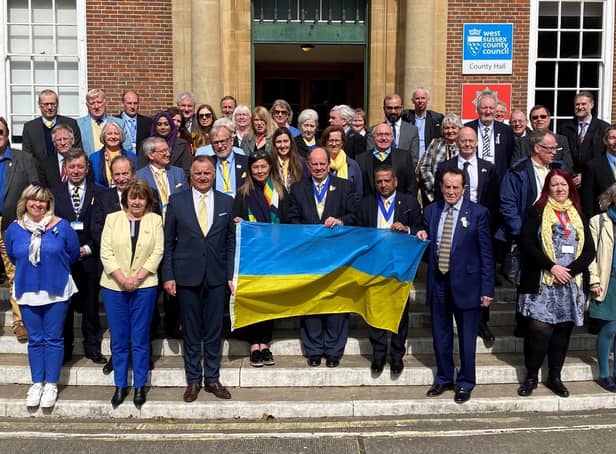 West Sussex county councillors show solidarity with the people of Ukraine on the steps of County Hall