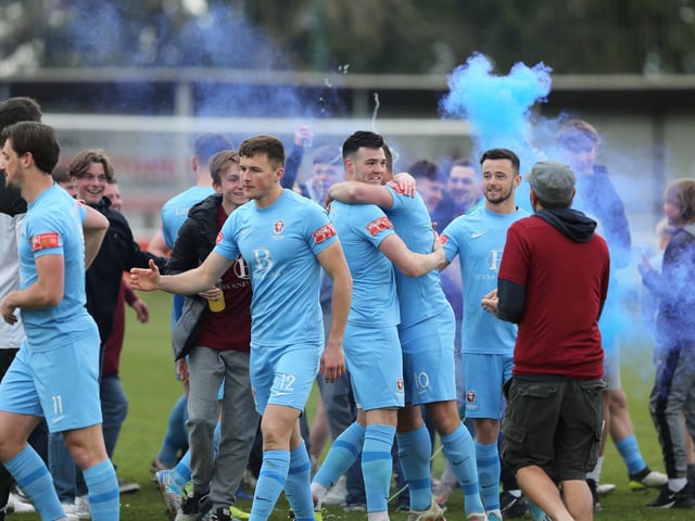 The celebrations get started after Hastings United clinch the Isthmian south east title with a point at Faversham / Pictures: Scott White