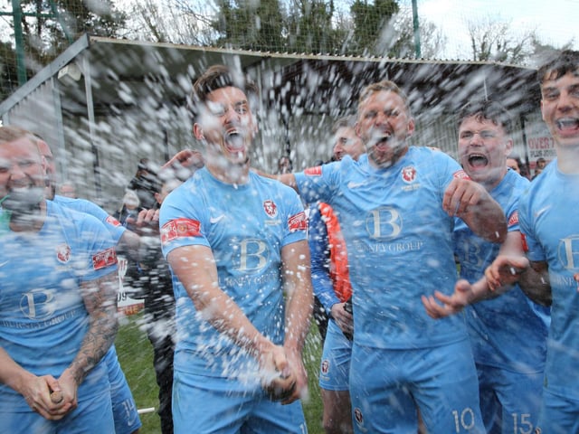 The celebrations get started after Hastings United clinch the Isthmian south east title with a point at Faversham / Pictures: Scott White