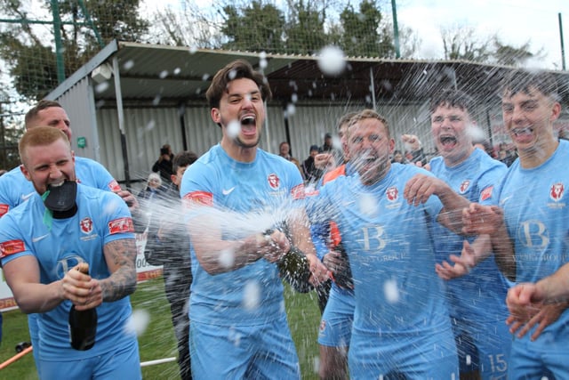 The celebrations get started after Hastings United clinch the Isthmian south east title with a point at Faversham / Pictures: Scott White