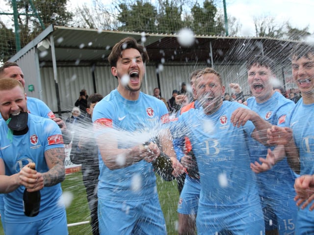 The celebrations get started after Hastings United clinch the Isthmian south east title with a point at Faversham / Pictures: Scott White
