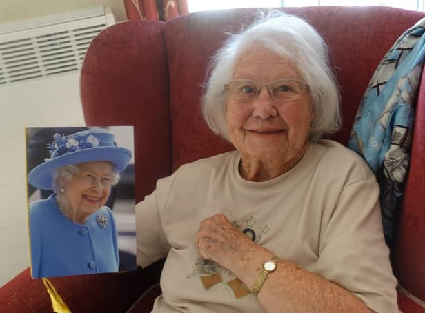 Brenda Templeton with the birthday card she received from the Queen