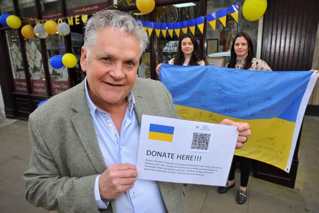 Dominic Sakakini has set up a Ukraine fundraising site to buy food and medical equipment. Pictured with colleagues Annabelle Patmore and Charlotte Walton. Pic S Robards SR2204121 SUS-221204-164517001