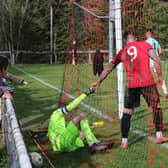 In the net - but it's the keeper not the ball