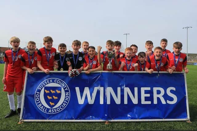 Eastbourne Unitred Youth U13s celebrate their county cup win / Picture: Simon Roe Photography