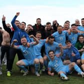 Hastings United players and staff celebrate winning the title / Picture: Scott White