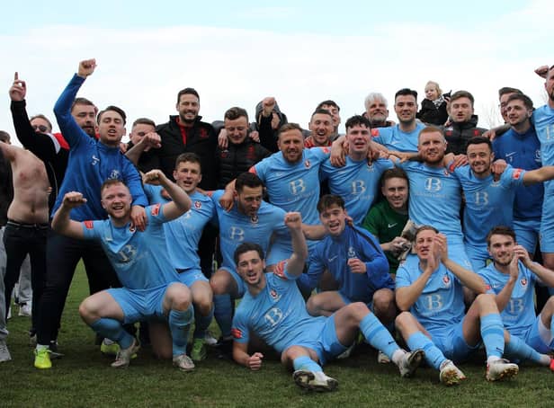Hastings United players and staff celebrate winning the title / Picture: Scott White