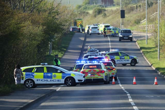 Emergency services at the scene of the collision. Picture by Eddie Mitchell SUS-220417-090901001
