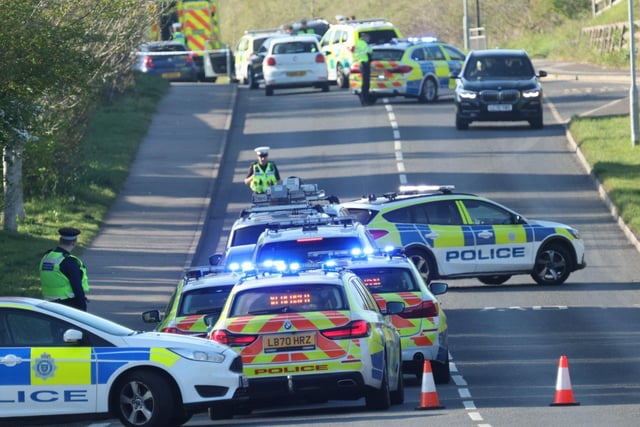 Emergency services at the scene of the collision. Picture by Eddie Mitchell SUS-220417-090911001
