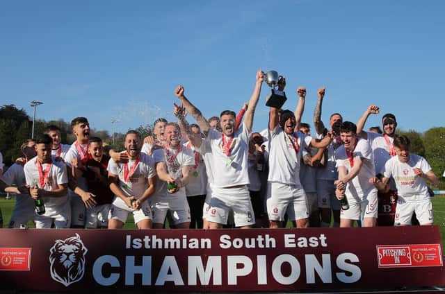 Champions! Hastings United lift the trophy / Picture: Scott White