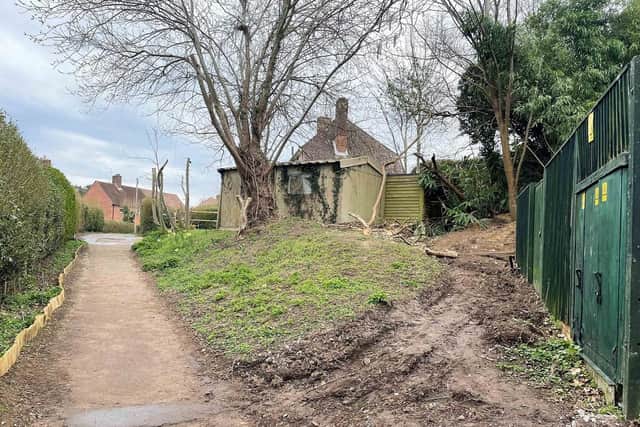 Two detached garages on a parcel of land with potential in a village setting in West Chiltington are coming up for auction next month