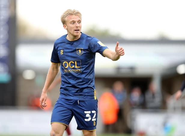 Promotion-chasing Mansfield will welcome back midfielder George Lapslie after completing a three game suspension
