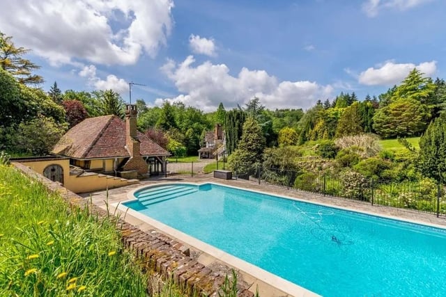 The large home has its own outside swimming pool. Picture: Strutt & Parker - Horsham.