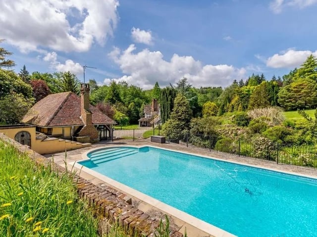 The large home has its own outside swimming pool. Picture: Strutt & Parker - Horsham.