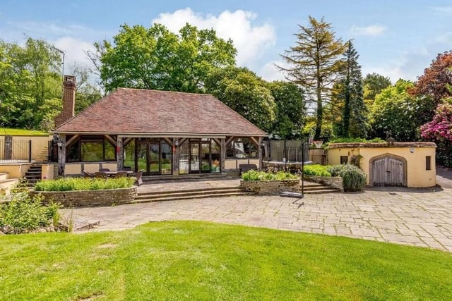 The large barn has been converted into an entertaining area with a vaulted ceiling and a woodburning stove. Picture: Strutt & Parker - Horsham.