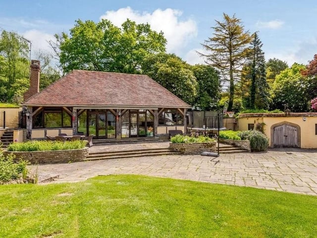 The large barn has been converted into an entertaining area with a vaulted ceiling and a woodburning stove. Picture: Strutt & Parker - Horsham.