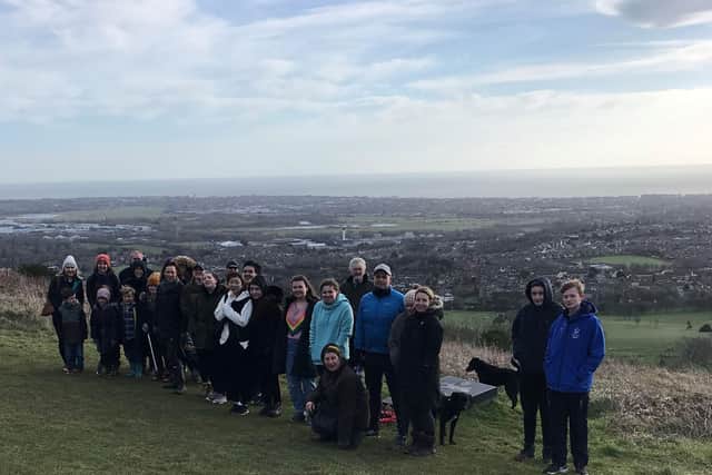 Tree planters gathered on the Downs. Picture from Eastbourne Borough Council SUS-220421-123436001