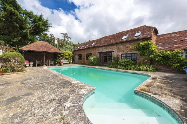 A period farmhouse with a converted Sussex barn, heated swimming pool and tennis court - on the market for £1,795,000 with Savills on Zoopla.