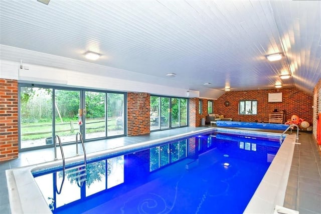 This Grade II listed thatched property includes an indoor swimming pool with sauna - on the market for £1,250,000 with Cubitt & West on Zoopla.